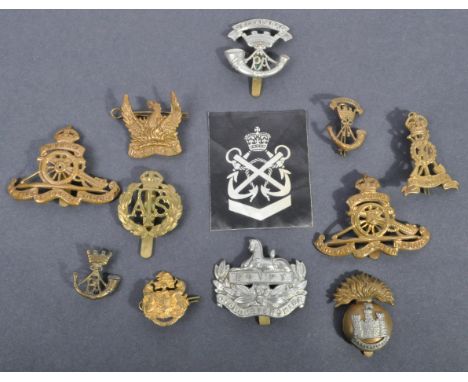 Cap Badges - a collection of WWI First &amp; WWII Second World War related British Army uniform cap badges. Comprising: Royal