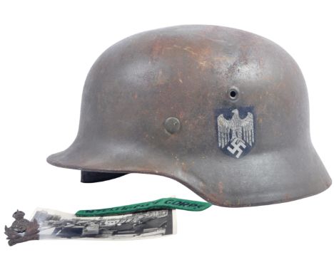 An original WWII Second World War Third Reich Nazi German Army issued M35 Stahlhelm Q62 steel combat helmet, by repute libera
