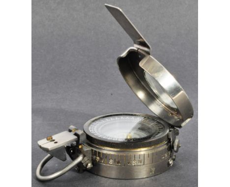 WWI First World War Interest - a 20th century steel marching / field compass, with glass viewing panel to top and various fol
