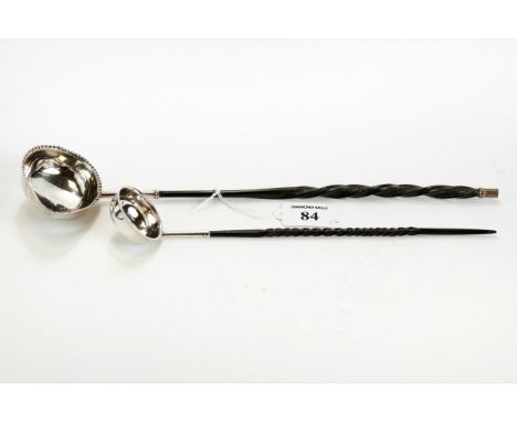 A 19TH CENTURY WHITE METAL PUNCH/TODDY LADLE, the oval beaded edge lipped bowl fitted with a twisted baleen handle, 32cms lon