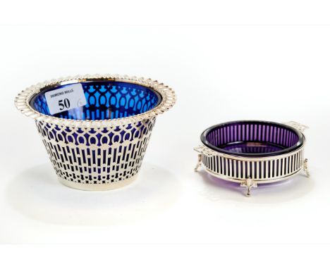 A GEORGE V SILVER PIERCED SIDED SUGAR BASIN with crimped rim &amp; blue-glass liner, maker: CW &amp; S, Birmingham 1910, 14cm
