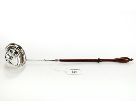 A GEORGE III SILVER PUNCH/TODDY LADLE, the oval reeded edge bowl with turned wooden handle, marks rubbed, 33cms long. £50-£80