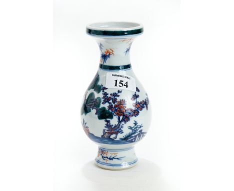 A CHINESE PORCELAIN BALUSTER SHAPED VASE with flared rim decorated with green enamel trees &amp; underglaze copper red &amp; 