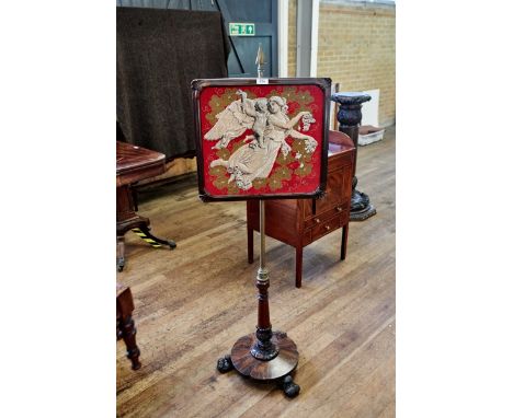 A VICTORIAN ROSEWOOD POLESCREEN, the beadwork panel screen raised on a brass arrow-head column with circular base and scroll 