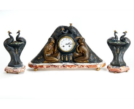P. SEGA, FRANCE, A FRENCH ART ART DECO PATINATED SPELTER CLOCK GARNITURE the round enamel dial with twin train movement marke