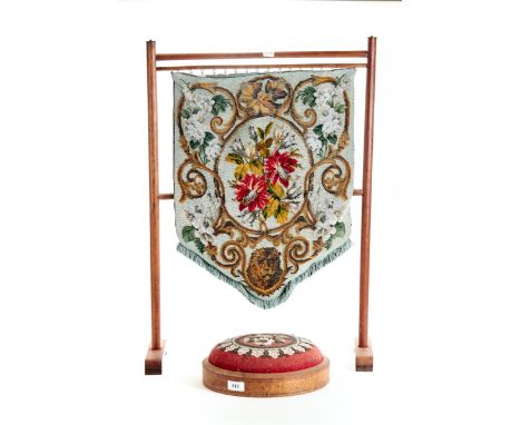 A VICTORIAN CIRCULAR WALNUT AND BANDED FOOTSTOOL with a beadwork upholstery, 29cms diameter together with a beadwork BANNER n