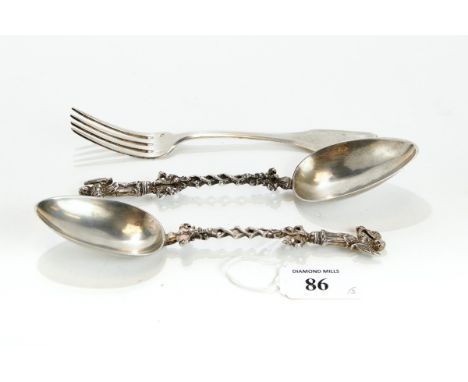 A PAIR OF CONTINENTAL WHITE METAL SPOONS, the cast handles with female figure terminals, 18cms long, together with a continen