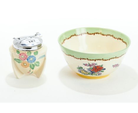 A 20TH CENTURY CLARICE CLIFF POTTERY SUGAR POT of ovoid form and three projecting legs, floral hand painted, chromium lid wit
