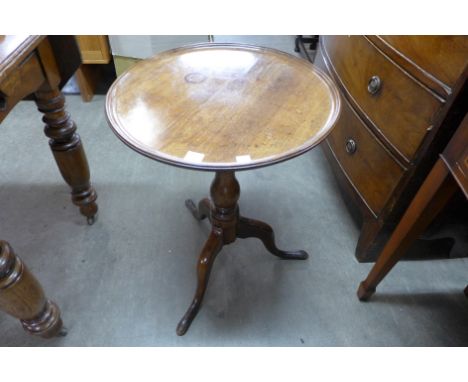 A George III mahogany circular dish top tripod table