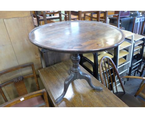 A George III mahogany circular tripod table