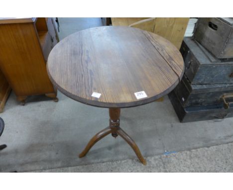 A Victorian pine tripod table