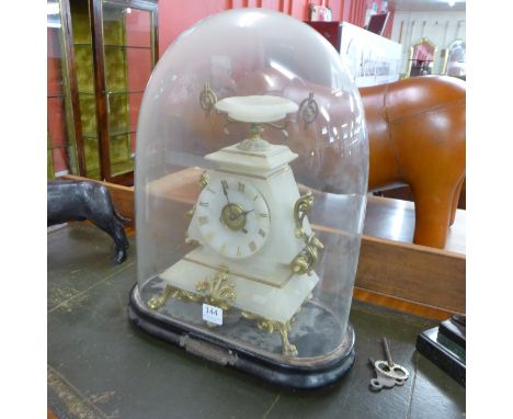 A 19th Century French onyx and ormolu mounted mantel clock, with ebonised plinth and glass dome