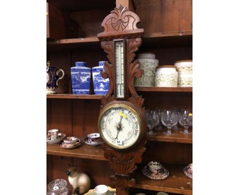 An oak cased barometer