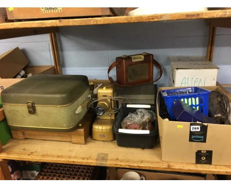 A shelf of assorted to include a projector