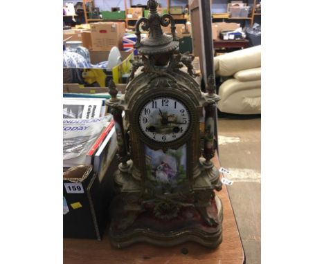 A Continental gilt metal and porcelain mantle clock