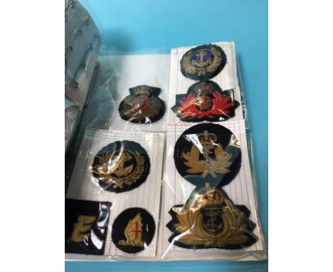 A collection of Merchant Navy badges and epaulettes