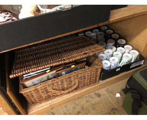 A shelf of assorted, to include mugs and a wicker hamper etc.