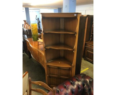 An Ercol corner cabinet