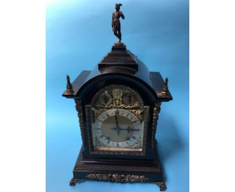A 19th century ebonised and ormolu bracket clock, with eight day movement, silvered chapter ring and brass spandrels, two sub
