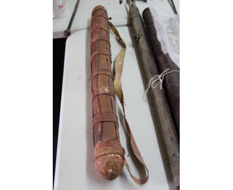 African: an old quiver containing hunting arrows, 76cm long, with shoulder strap. 
