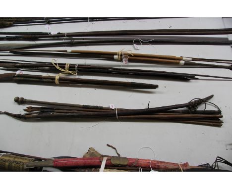 African: a bow, approx 117cm long; together with five metal tipped arrows; and a wooden stick. (7)