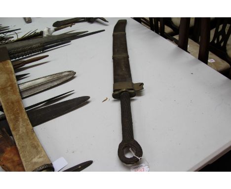 A Chinese sword, having rope bound handle with brass crossguard, with wooden scabbard having brass bands, approx 83cm long. 