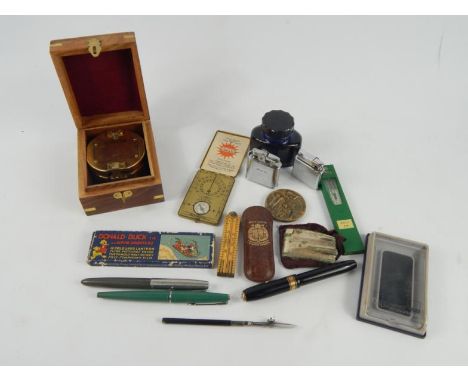 An Ansonia Sunwatch, Hockley Abbey folding ruler, pocket lighters, Conway Stewart and Parker pens, Ensign magic lantern slide