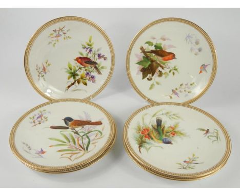 A set of six Royal Worcester porcelain late 19thC plates, painted with birds and blossom within a jewelled border, printed ma