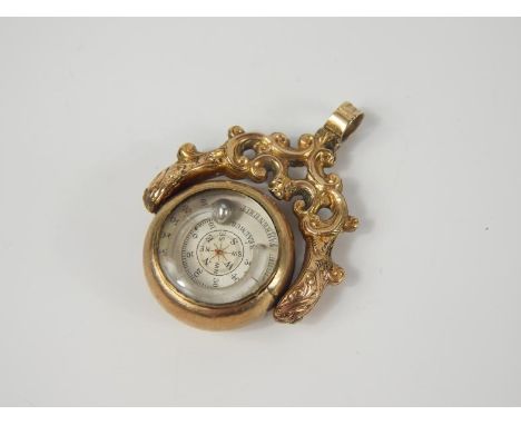 A 19thC gilt metal swivel pendant fob, set to one side with a compass and barometric gauge with Fahrenheit and Reaumur Scales
