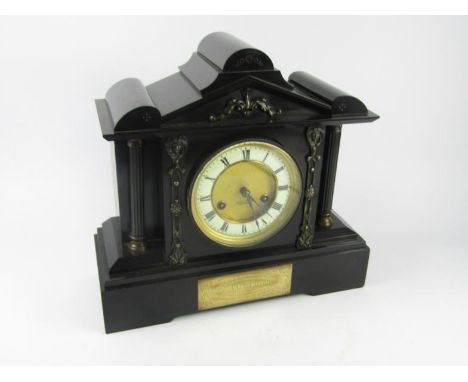 A Junghans slate and marble cased late 19thC mantel clock, brass dial with enamel chapter ring bearing Roman numerals, eight 