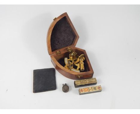 A brass sextant, cased, trench art pocket lighter, wallet and a set of poker dice, (4).