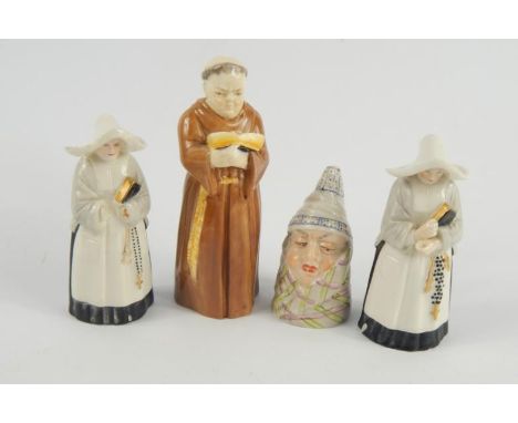Four Royal Worcester porcelain candle snuffers, comprising Mr Caudle, a monk, and two nuns, (AF).