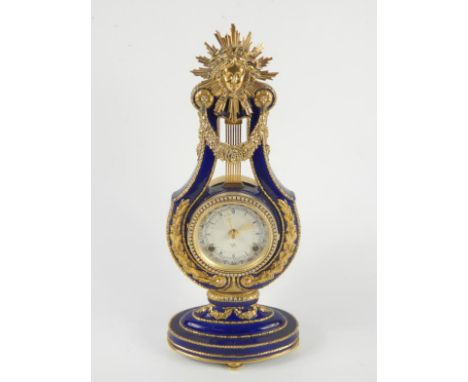 A Victoria & Albert Museum porcelain and brass Marie Antoinette mantel clock, the astrological dial bearing Roman numerals, p