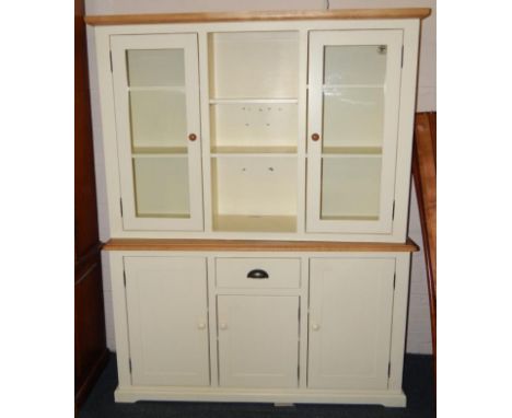 An ash and cream painted kitchen dresser, with a central recess enclosing two adjustable shelves, flanked by two glazed doors