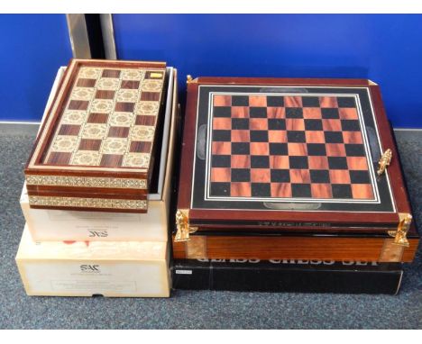 Two Studio Anne Carlton Chess Sets, modernist chess set with box board, two glass chess sets, an Egyptianesque chess set and 