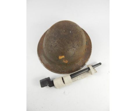 A WWI helmet and an Enfield spike bayonet, (2).