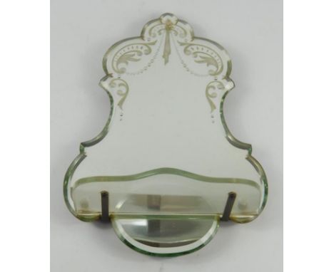 A Venetian bevelled glass wall mirror, with acid etched foliate decoration and a protruding shaped shelf, 36cm x 24cm.