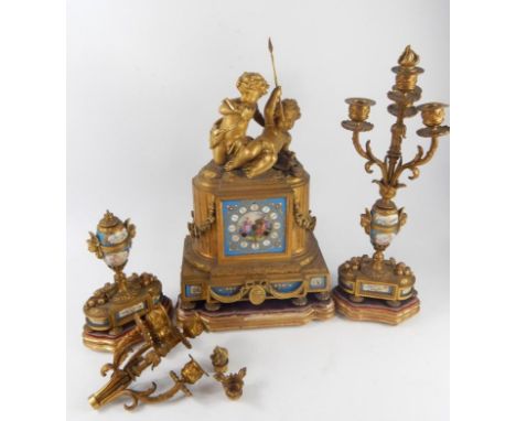 A French late 19thC ormolu and porcelain desk garniture by Japy Freres Et Cie, the clock with fluted and garland draped trium