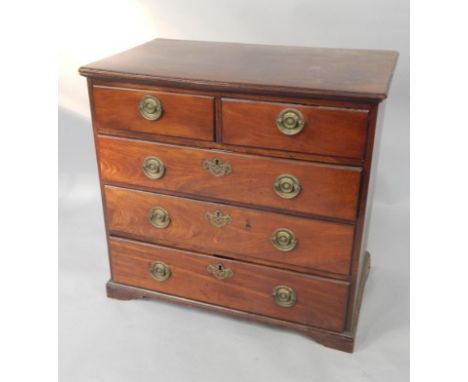 A George III mahogany chest of drawers, two short and three long drawers raised on bracket feet, cut down, 84cm x 50cm x 75cm
