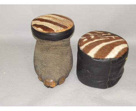 An elephant's foot stool with a zebra skin top, 48cm x 38cm, and a leather pouffe with a zebra skin seat, (2).