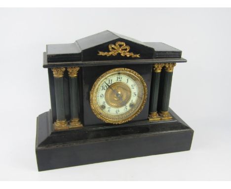 An Ansonia Clock Company cast iron architectural mantel clock, of temple form, brass dial with enamel chapter ring bearing Ar