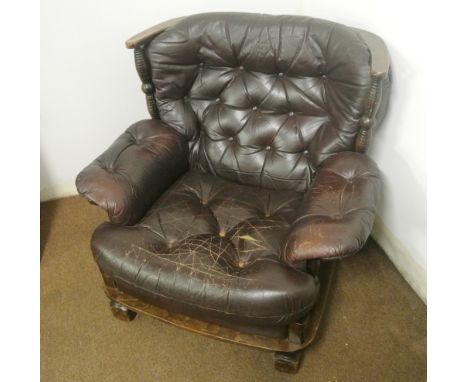 FURNITURE/ HOME - A comfortable oak & brown leather button back armchair. 