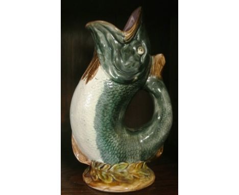 VINTAGE/ CERAMIC - An Dartmouth pottery  'Glug Jug', in the form of a fish. Measures 23cm tall.