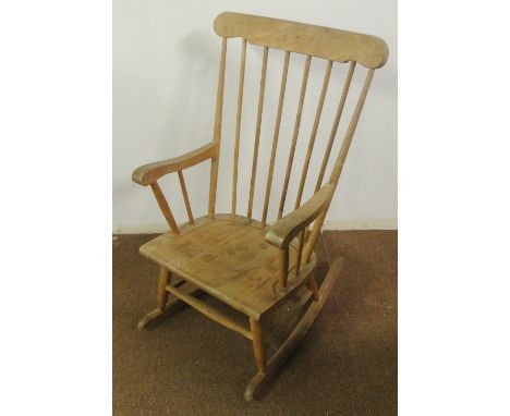 ANTIQUE/ FURNITURE - A vintage stick back pine rocking chair with some light age related wear.