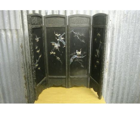 ORIENTAL/ VINTAGE - A decorative Oriental style wooden fire screen with mother of pearl inlay in the form of birds. Measures 