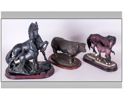 Three Ceramic Animal Figures On Plinths, one of a highland bull, the other of horses with foals.