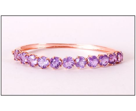 Flower Cut Rose de France Amethyst Bangle, eleven Rose de France amethysts, totalling 15cts, in an unusual flower cut, set in