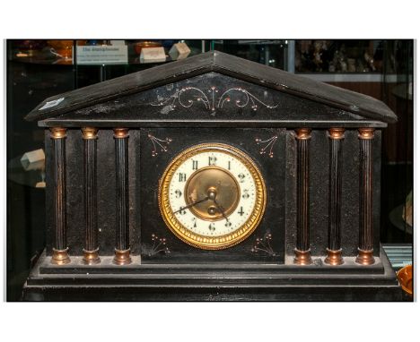 Black Slate Mantle Clock, 8 day movement, ceramic dial and Arabic numerals. 12 inches high.