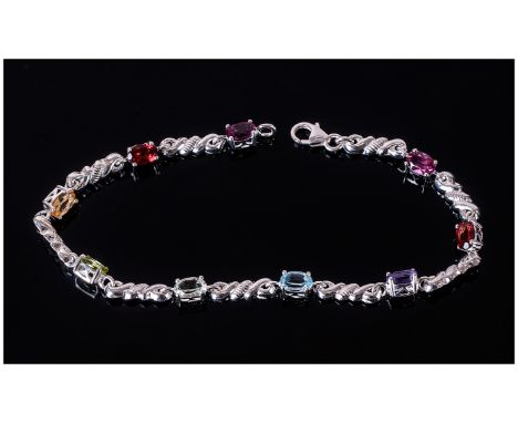 Multi Gemstone Bracelet comprising oval cuts of rhodolite and red garnet, citrine, peridot, green amethyst, sky blue topaz an