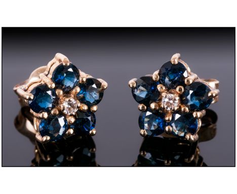 Ladies 9ct Gold and Sapphire Set Pair of Earrings, Flower head Design. Fully Hallmarked. 